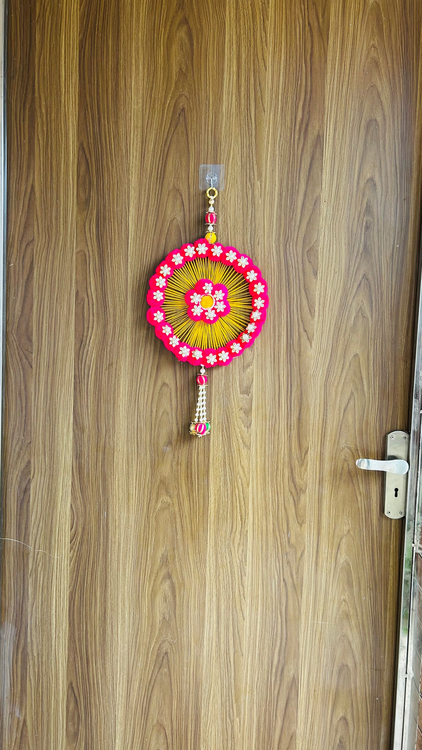 Kalakriti Handcrafted Floral Round Wall Hanging – Pink & Yellow Pom-Pom Decor with Pearl Accents for Home & Festive Decoration